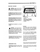 Technical manual page on seat belt and ROPS installation for a vehicle.